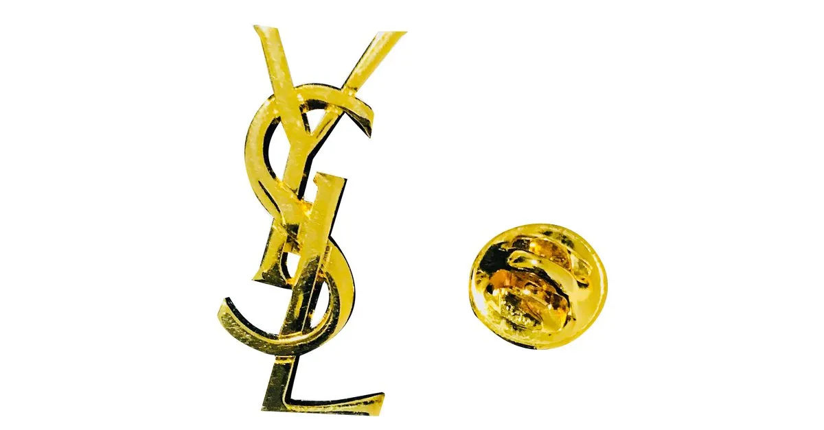 Yves Saint Laurent Alfileres y broches Dorado 