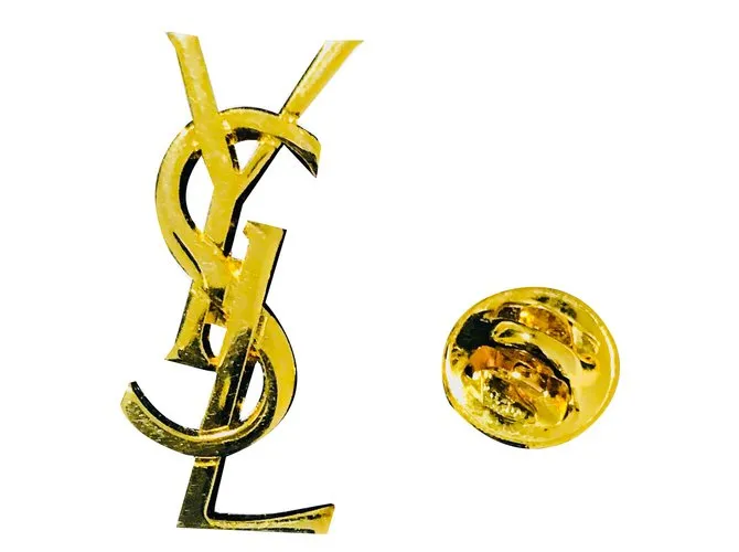 Yves Saint Laurent Alfileres y broches Dorado 
